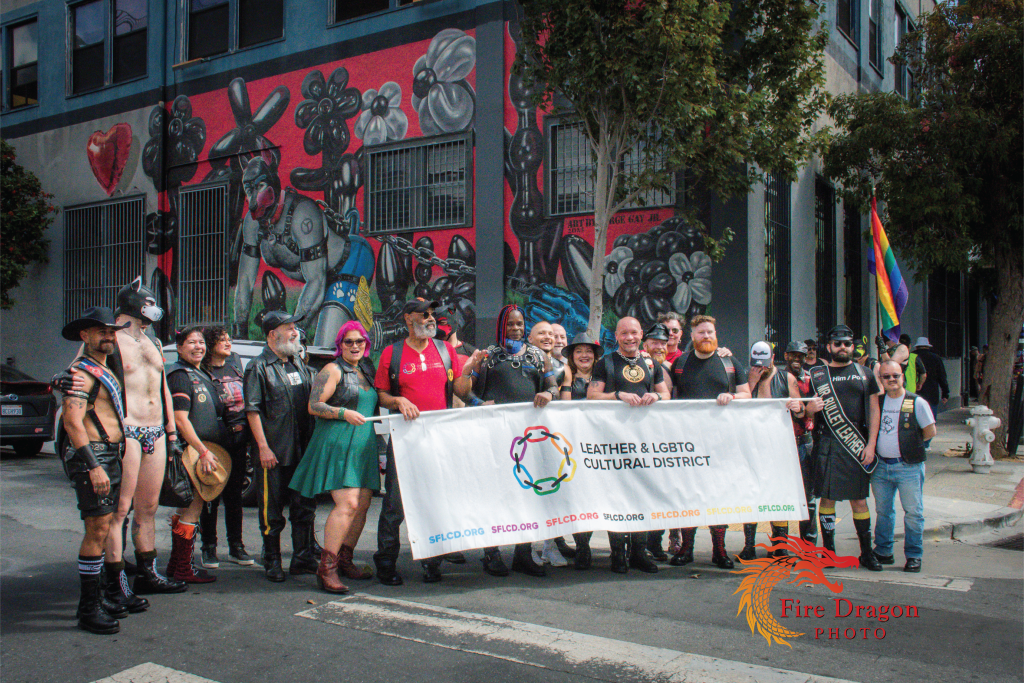 LeatherWalk 2023 pauses in front of Mr. S Leather mural. Photo by Fire Dragon Photo